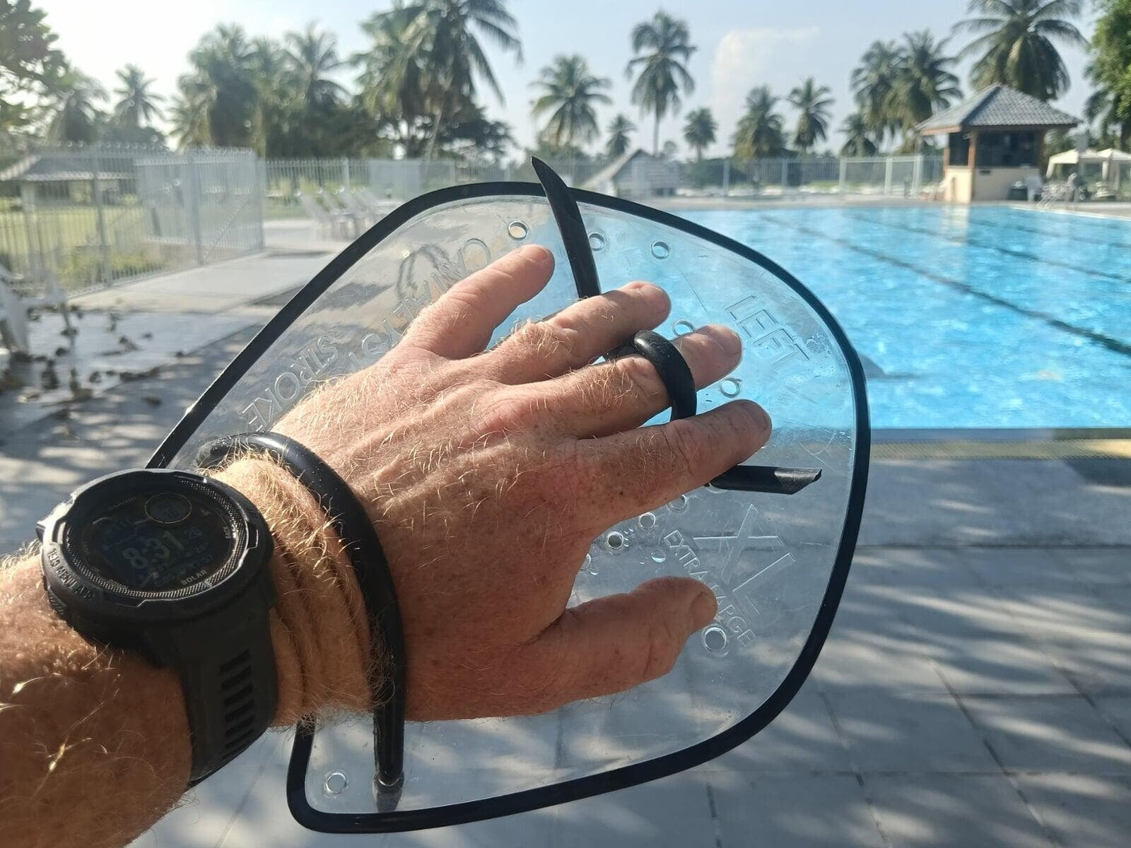 Use of swimming aids to increase strength is a normal element of our swim coaching packages