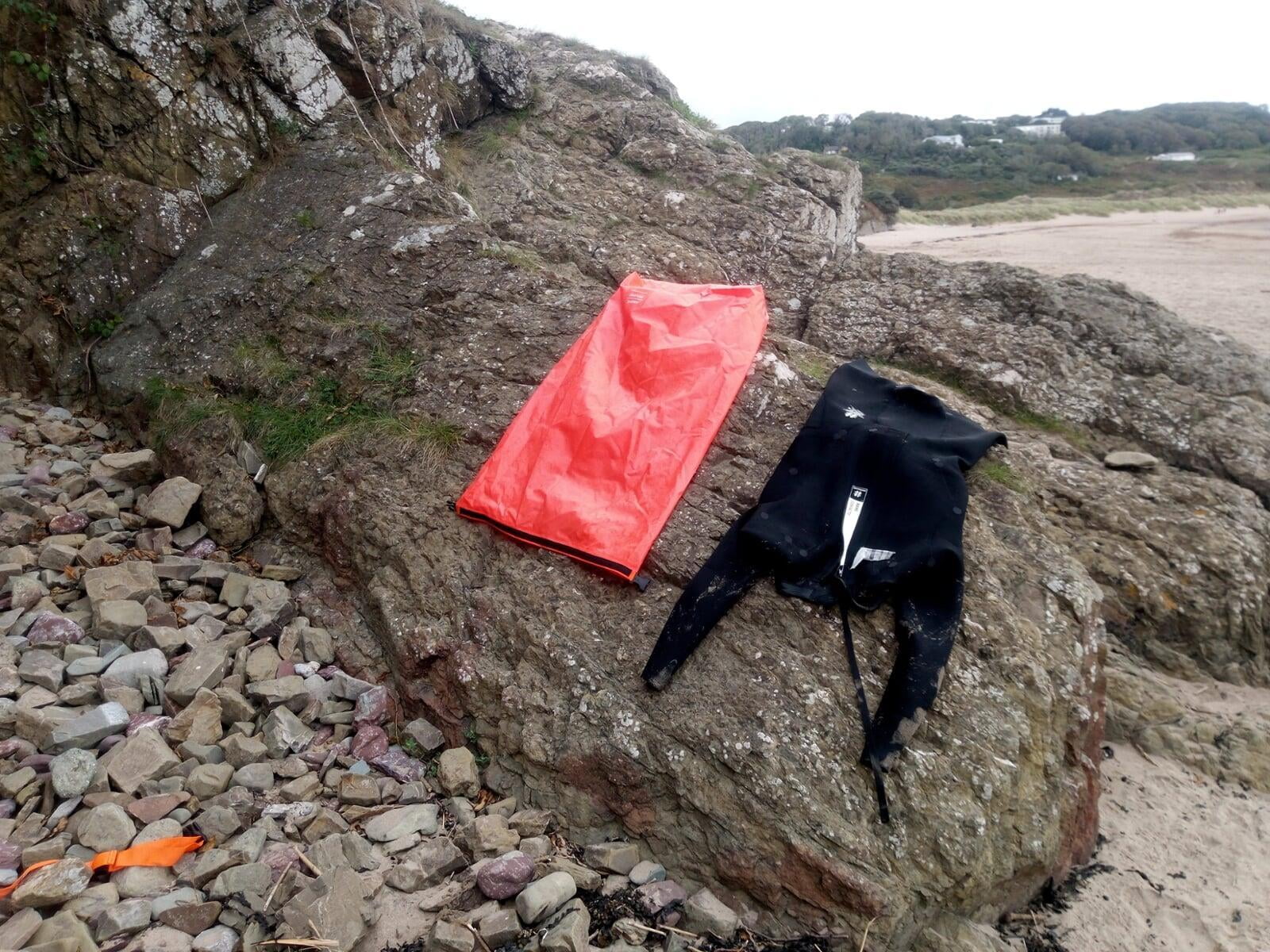 Drying gear after a swim prior to the hiking leg