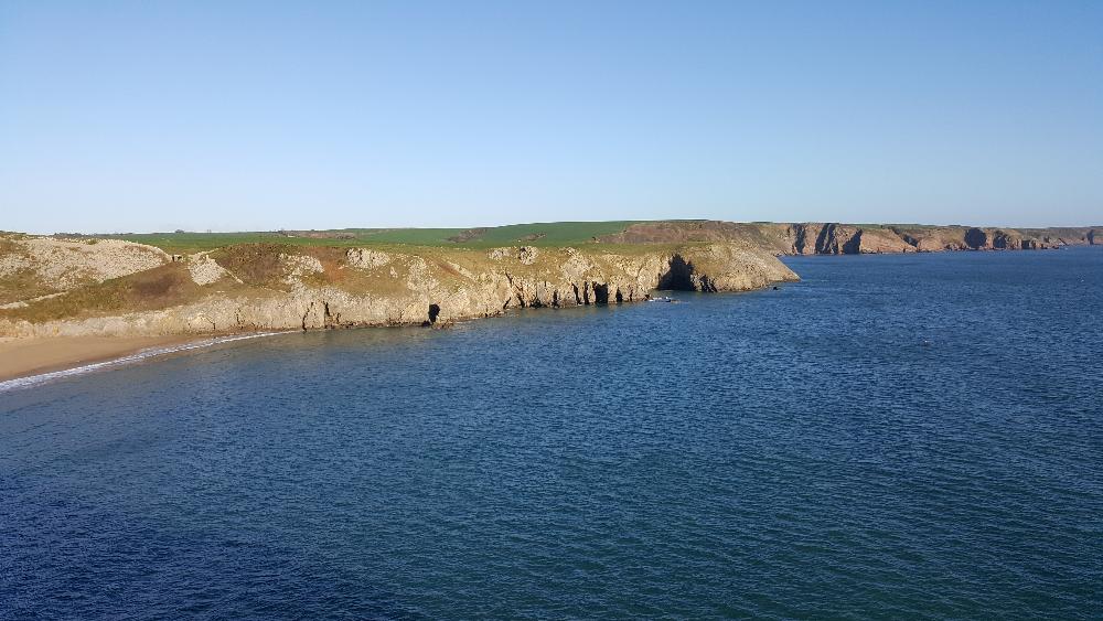 Sea swimming in Barafundle Bay, Pembrokeshire Wales UK