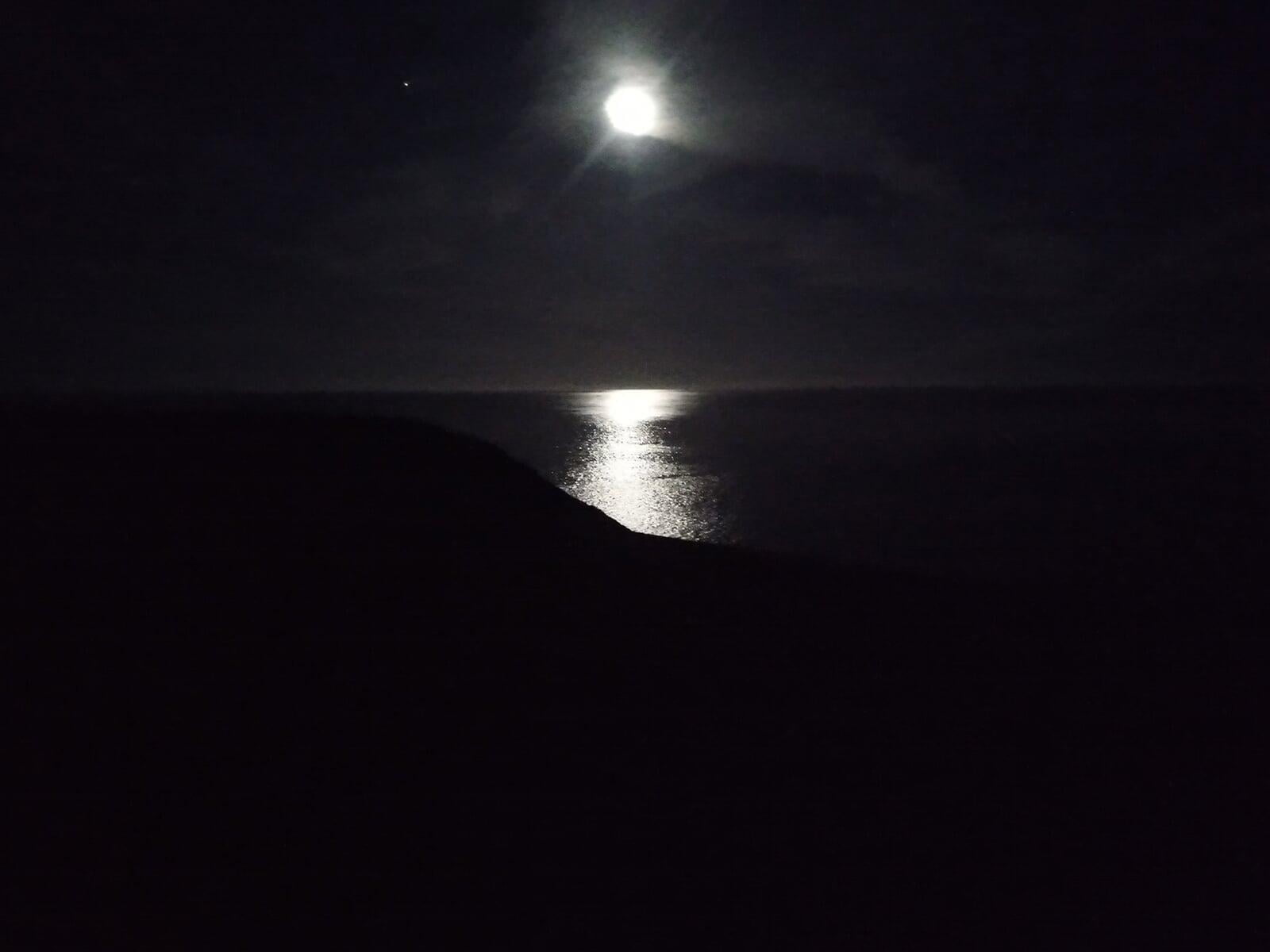 View of the ocean on a full moon, Barafundle Bay
