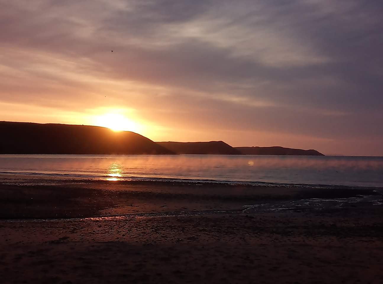 Sea swimmng at sunrise in Pembrokeshire